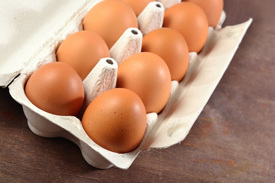 Carton of fresh brown eggs