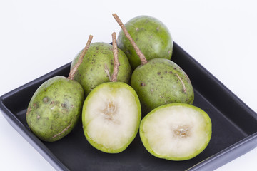 Fresh Hog plum (Wild Mango) on black dish