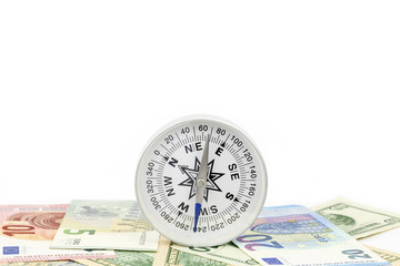 Compass on banknote for financial direction on white background