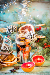 mulled wine with orange and spices on wooden background.Christmas decoration