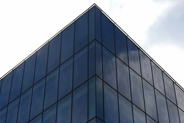 Fototapeta na wymiar glass facade of the building against the sky
