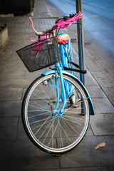 Fototapeta na wymiar Objects: Blue bike on the sidewalk