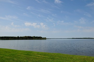 coastline of the lake under the blue sky