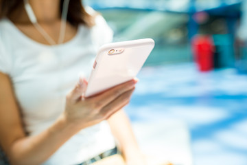 Woman listen to music on cellphone