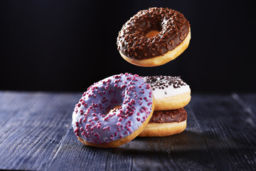 Falling donuts on a dark background