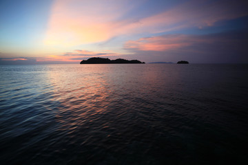 Fototapeta na wymiar asian island on blue water with blue sky