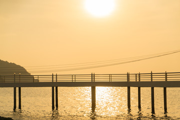Fototapeta na wymiar bridge and sea with sunrise light