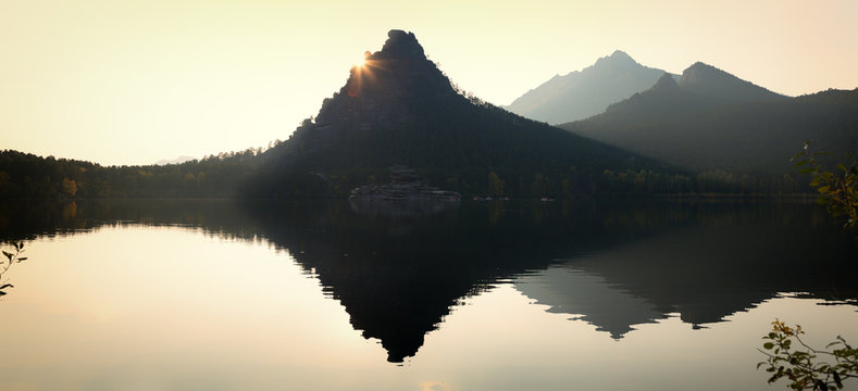Silhouette of cliff Okzhetpes at sunset in Natonal park Burabay (Borovoe), Kazakhstan 