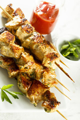 Chicken skewers with tomato sauce