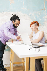 Young people working in the grunge office