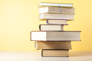 Stack of colorful books. Education background. Back to school. Copy space for text.