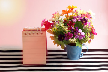 Beautiful pink flowers with a message card paper in a vintage su