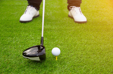 Golfers player golf swing shot on grass in the summer day - Golf sport lifestyle holiday concept