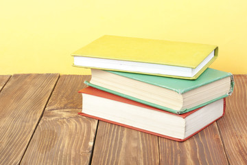 Stack of colorful books. Education background. Back to school. Copy space for text.