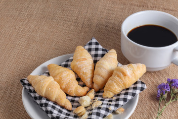 close up to mini croissants on back napkin background, sackcloth