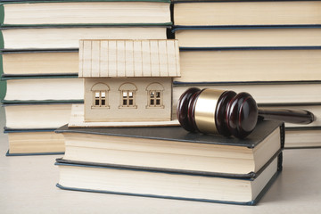 Law concept - Book with wooden judges gavel on table in a courtroom or enforcement office.