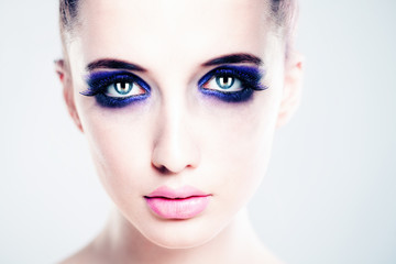 Fototapeta premium Perfect Face with Artistic Makeup. Beautiful Woman Fashion Model