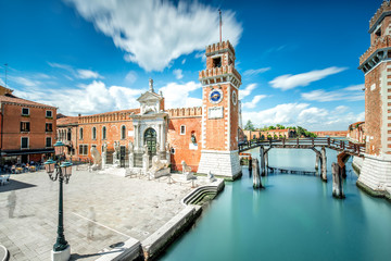 Venetian Arsenal in Castello region in Venice. Long exposure image technic with motion blurred clouds - obrazy, fototapety, plakaty