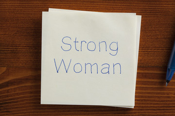 Strong Woman written on a note