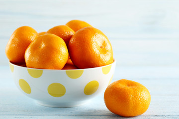 Ripe mandarins on a blue wooden table