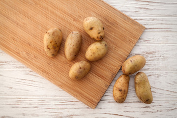 potato still life on wood background flat lay