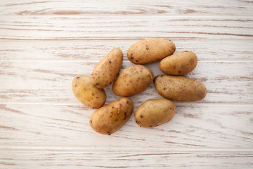 potato still life on wood background flat lay