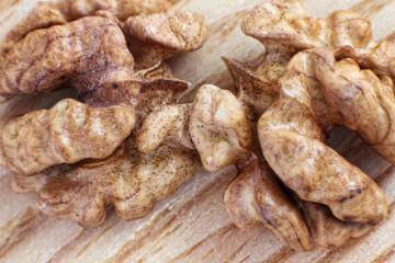 Walnut kernel on wooden table.