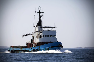 Rusty fishing vessel on the sea