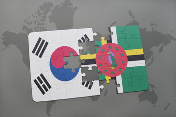 puzzle with the national flag of south korea and dominica on a world map background.