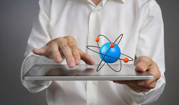 Man scientist holding a tablet PC with atom model, research concept