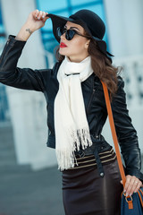 Fashion autumn woman in leather jacket outdoors
