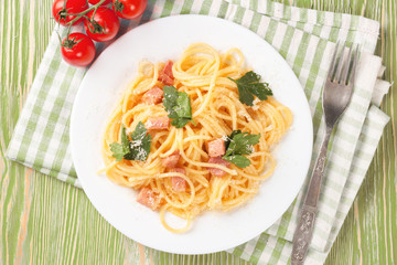 Pasta ingredients on green background.