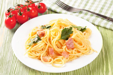Pasta ingredients on green background.