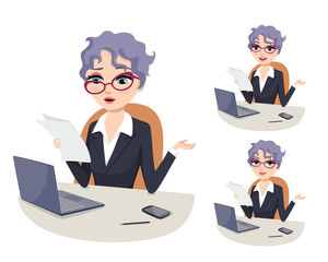 confused senior female executive wearing glasses and holding documents at the office