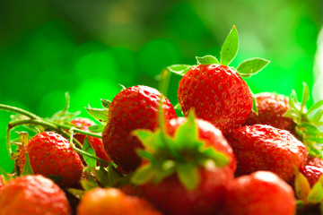 fresh strawberries closeup on the blurry background
