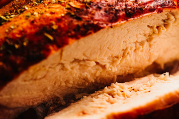Fresh baked chicken meat with golden brown closeup