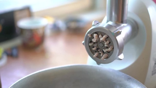 Action of mincer machine with fresh chopped meat in 4K