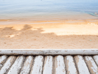 Wood table over beach background