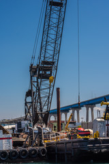 Fototapeta na wymiar loading or discharging tower crane at a sea port