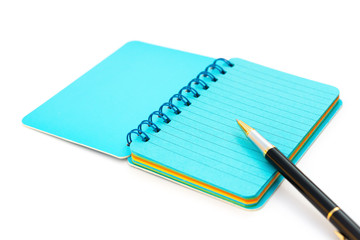 pen and colorful notebook on white