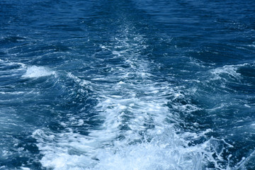 Summer travel to the black sea. Boiling blue water after boat