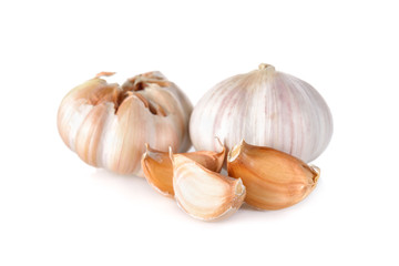 uncooked whole garlic with shell on white background