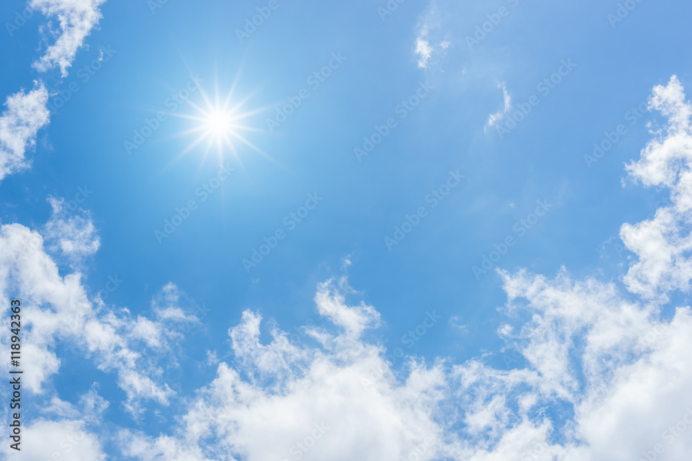 Wall mural blue sky with clouds and sun reflection. looking up view