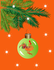 елочный шарик и изображением петуха висит на еловой ветке.Новогодняя открытка.