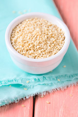 sesame seeds on wooden surface