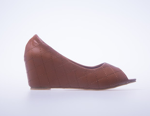 shoe. Brown colour fashion woman shoes on a background.