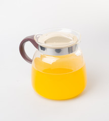 Orange juice in jar on a background.
