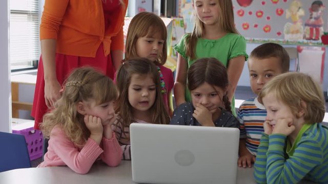 Kids using laptop at pre-school - 4K