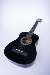 Fototapeta premium guitars or black color guitars on a background.