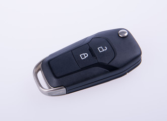key or car key with remote on background.